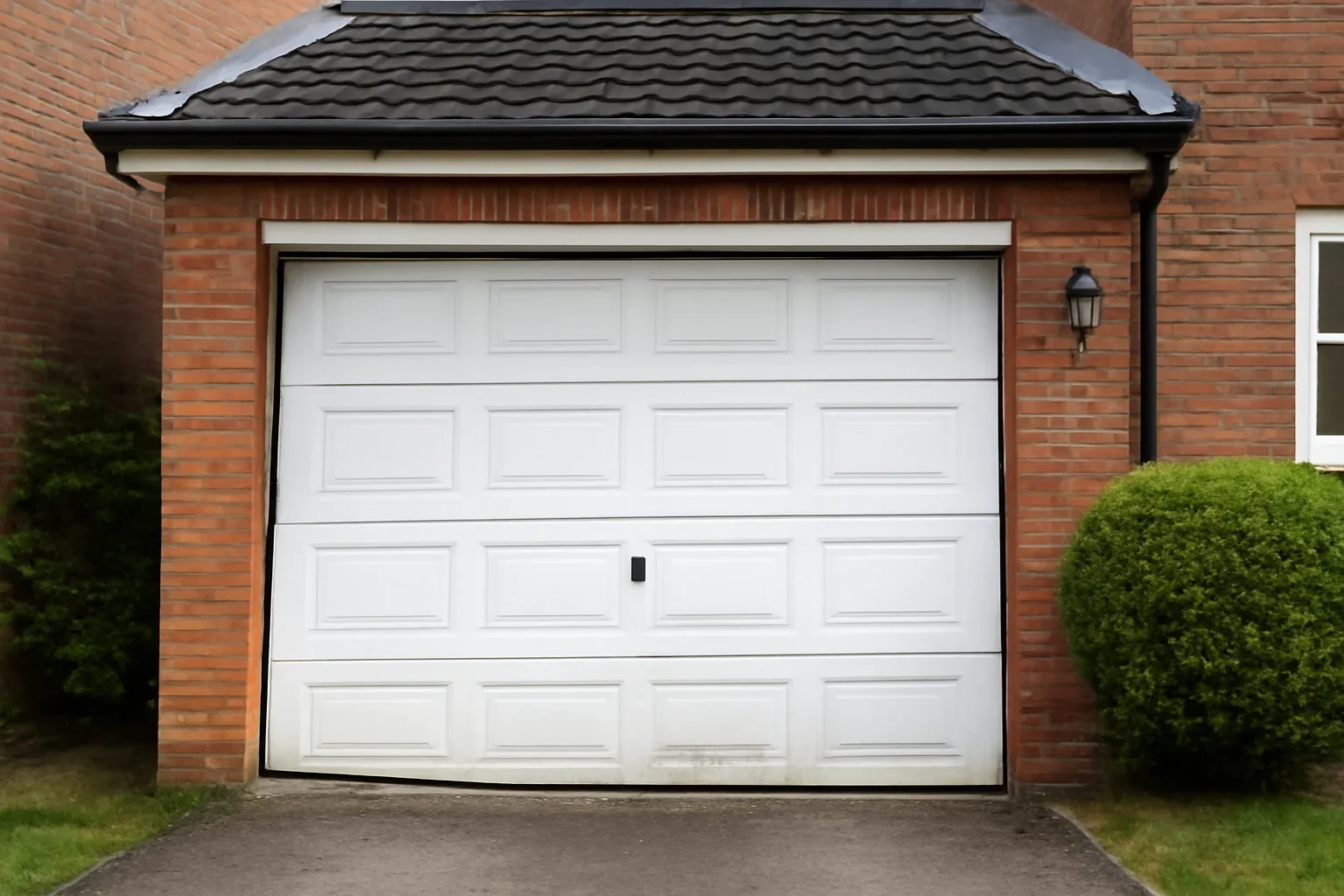 Editorial visual for blog why is my garage door crooked or uneven in a Surrey garage setting